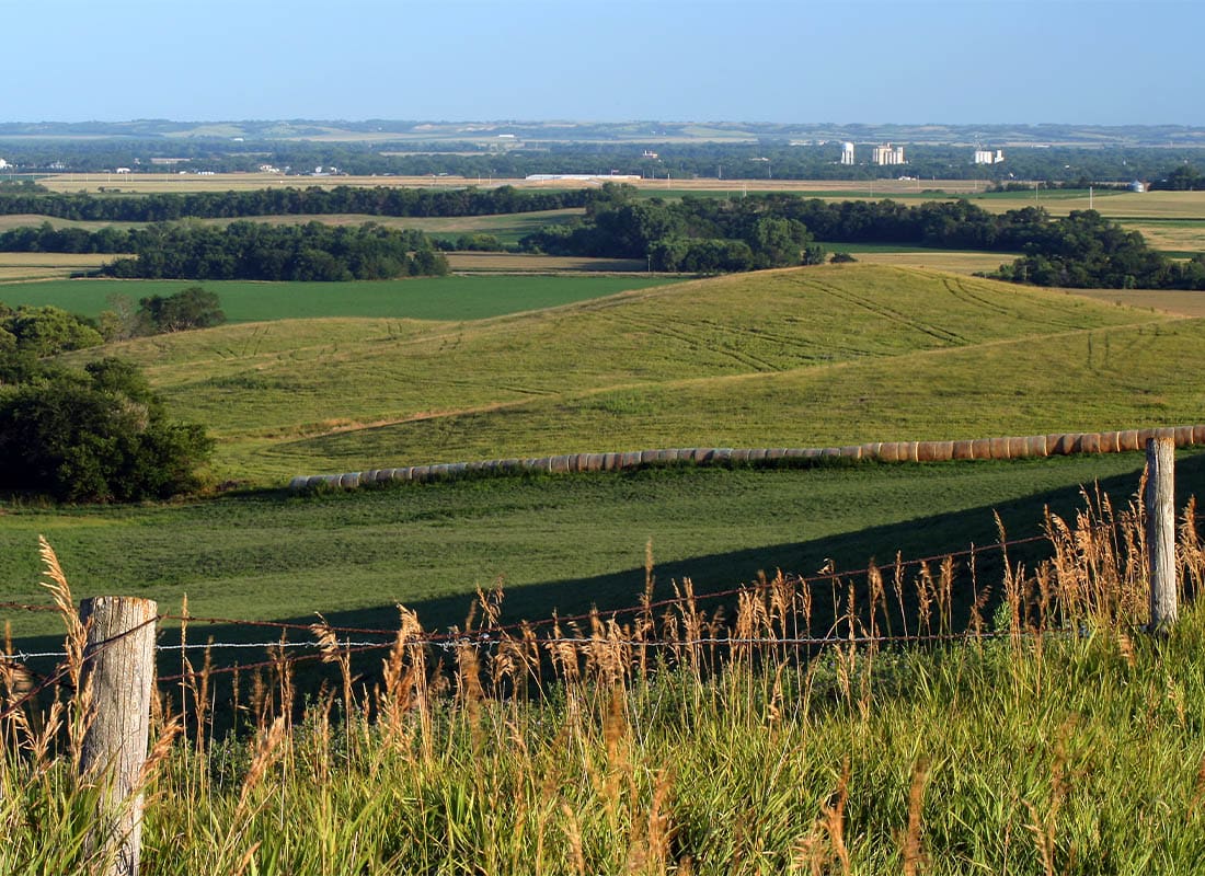 David City, NE - Large Farm Fields With a Small Town in the Background in the Countryside