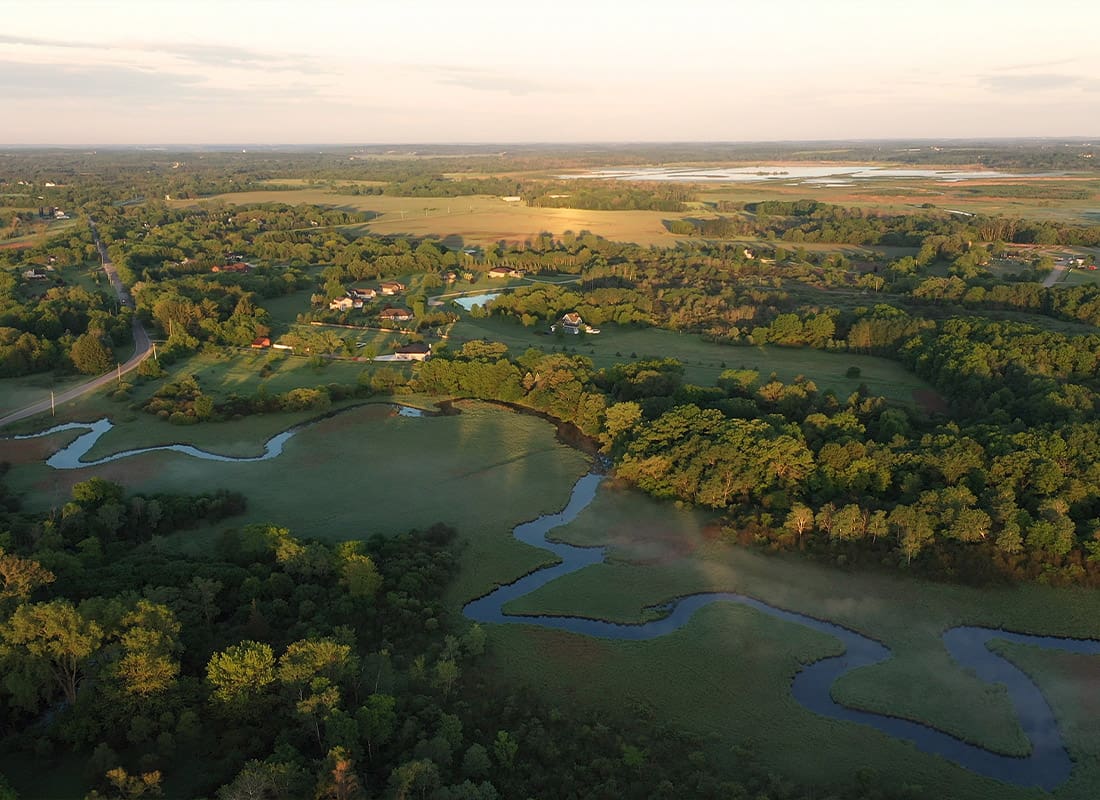 Lake in the Hills, IL - Lush Trees and Long Stream in the Countryside in Lake in the Hills, IL