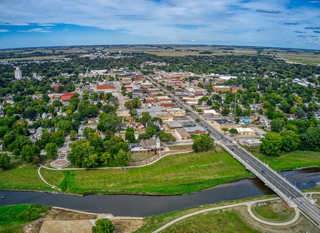 Spencer, IA - Aerial View of Small City With Highway Running Through