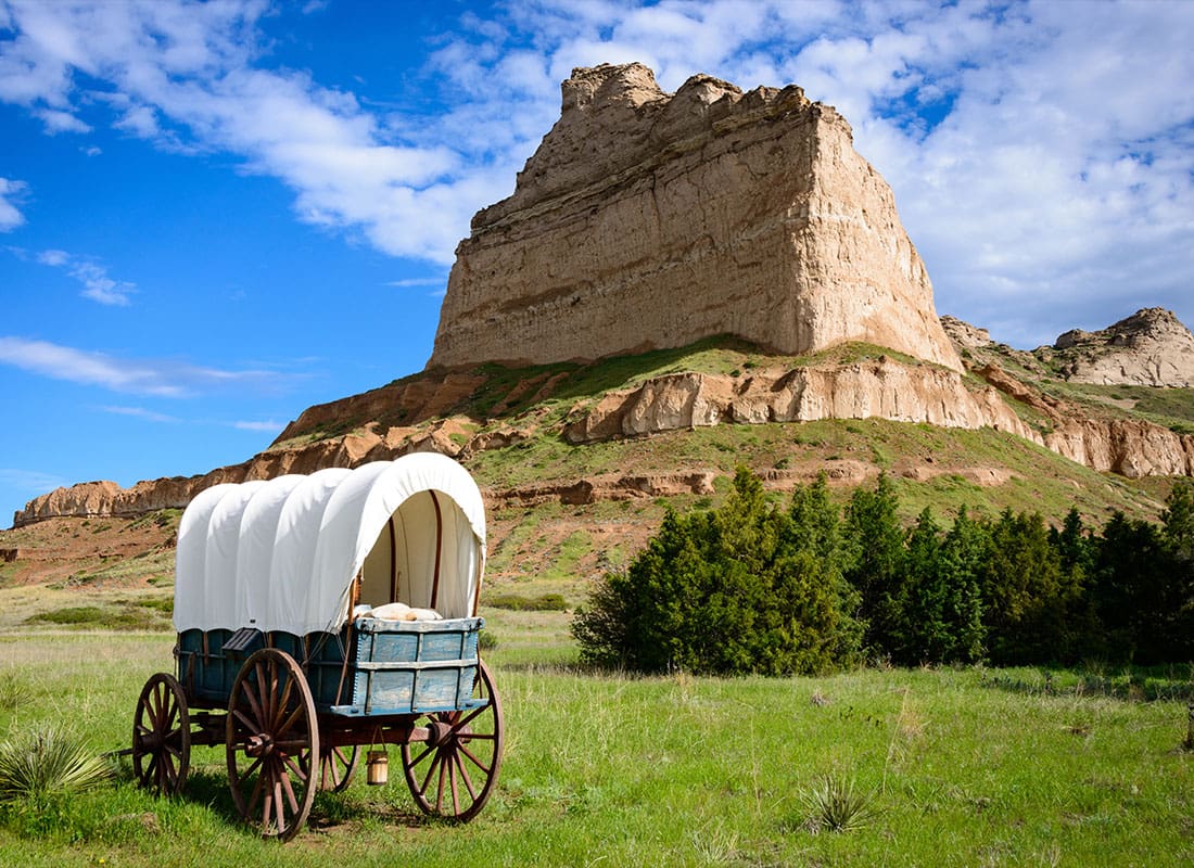 Tekamah, NE - Large Mountain in the Background With Old Wagon in the Front
