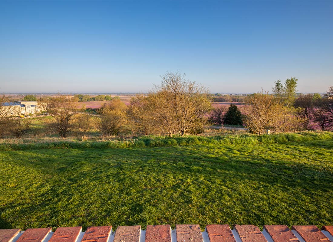 York, NE - Front Porch of a House Overlooking Farm Lands